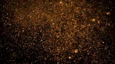 Soyut hareket arka planı parlayan ışık parçacıkları. Bokeh 'le parıldayan parçacıklar. Kusursuz 4K döngü video canlandırması