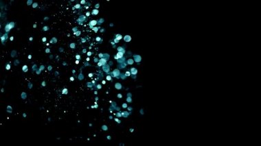Soyut hareket arka planı parlayan ışık parçacıkları. Bokeh 'le parıldayan parçacıklar. Kusursuz 4K döngü video canlandırması