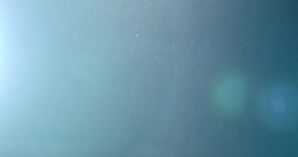Fond abstrait avec animation de particules volantes et scintillantes comme bokeh de lumière. Animation de boucle sans couture. Bulles de poussière animation neige.
