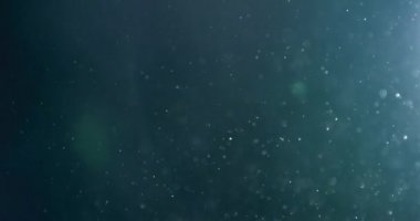 Uçan ve titreşen parçacıkların ışık demeti olarak canlandırıldığı soyut bir arkaplan. Kusursuz döngünün animasyonu. Toz baloncukları kar animasyonu..