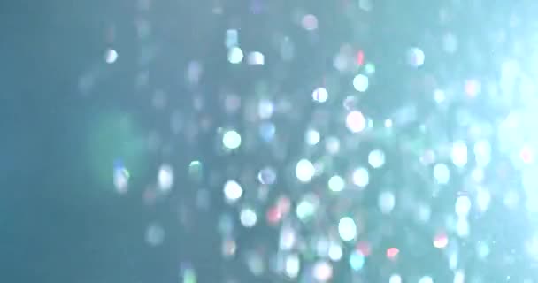 Uçan ve titreşen parçacıkların ışık demeti olarak canlandırıldığı soyut bir arkaplan. Kusursuz döngünün animasyonu. Toz baloncukları kar animasyonu.. — Stok video