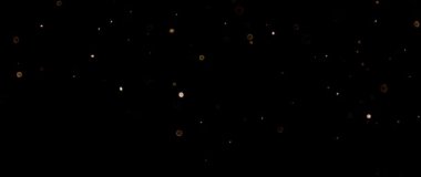 Güzel altın parıldayan parçacıklar, yavaş çekimde siyah zemin üzerinde parlayan mercekler..