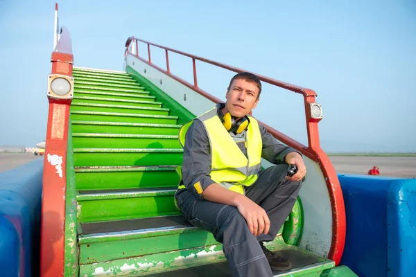 airport worker radio coordinate control ladder terminal