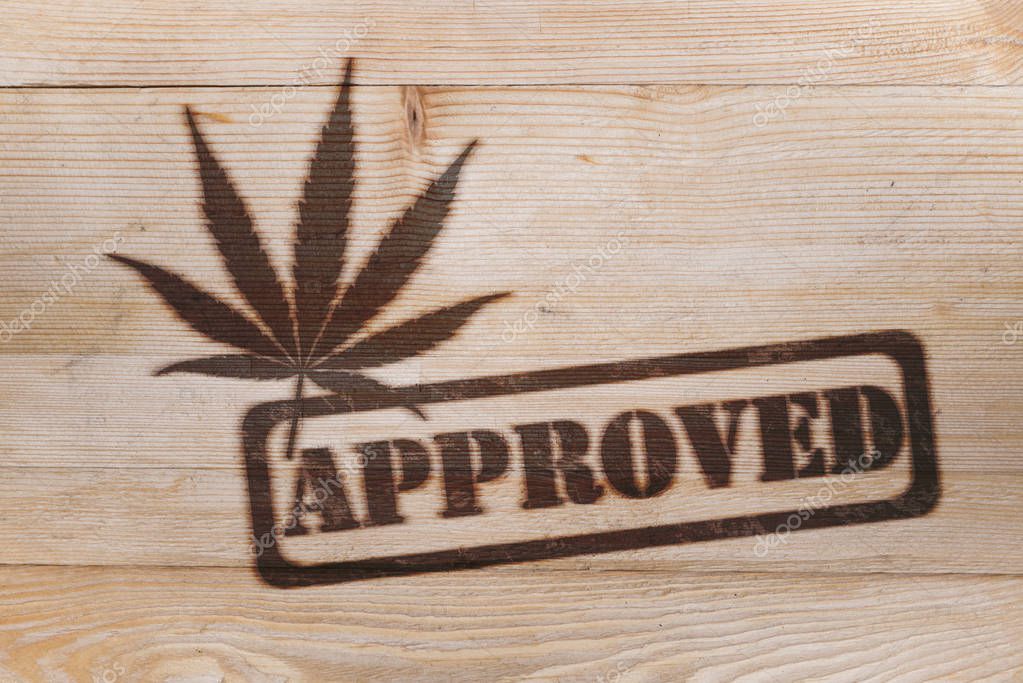 Cannabis weed approved stamp  fire branded logo on wood board
