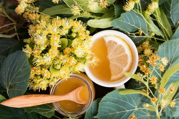 linden flowers, herbal medicine, Cup of healthy  tea with honey and lemon.  alternative or complementary medicine, traditional medicine. soft focus image