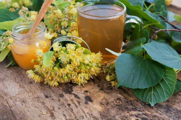 linden flowers, herbal medicine, Cup of healthy tea with honey and lemon. alternative or complementary medicine, traditional medicine. soft focus image