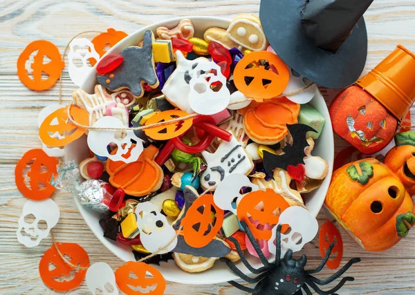 Halloween Jack o Lantern candy bowl with pumpkin sweets, candy and halloween cookies Trick or Treat