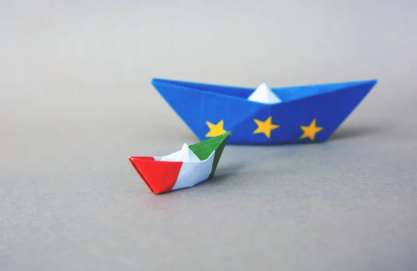 paper ship with Flags of European Union and Italy