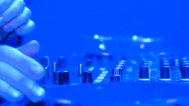 Techno party. People dance, DJ playing music. Everywhere colored lights — Stock Footage Techno Party People Dance Playing Music Everywhere Colored Lights Stock Footage