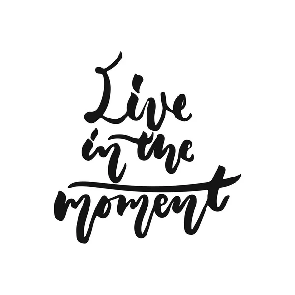 Live in the moment - hand drawn motivation lettering phrase isolated on the white background. Fun brush ink vector illustration for banners, greeting card, poster design. — Stock Vector