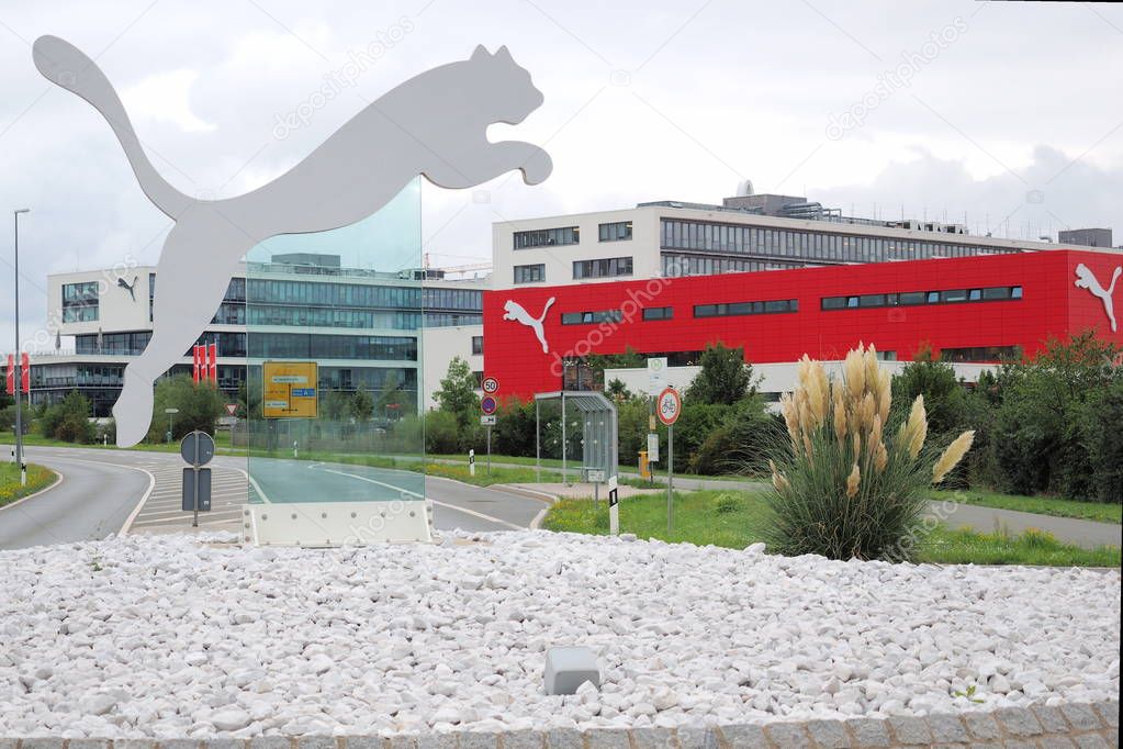 Herzogenaurach, Germany - August 19, 2019:  Puma logo and headquarter of global sports brand Puma in the village of Herzogenaurach