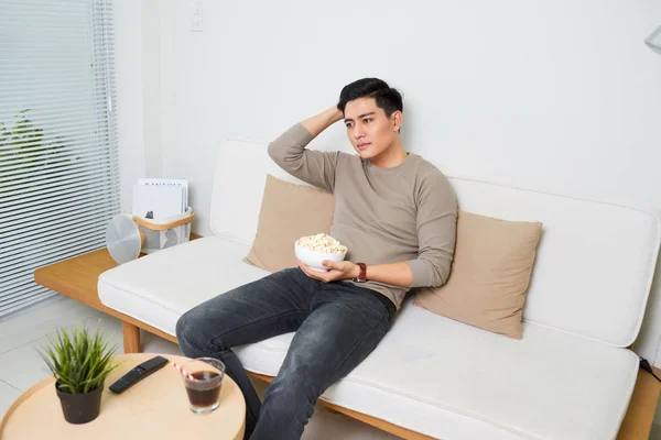 Bored Asian Man Watching Couch Home Living Room — Stock Photo, Image
