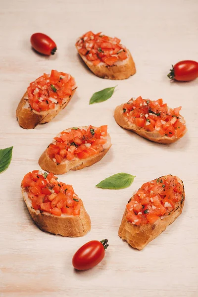 Italian Bruschetta Roasted Tomatoes Mozzarella Cheese Herbs Paper — Stock Photo, Image