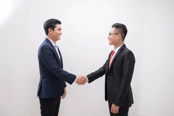 Side View Two Smiling Young Businessmen Shaking Hands White Background — Stock Photo, Image