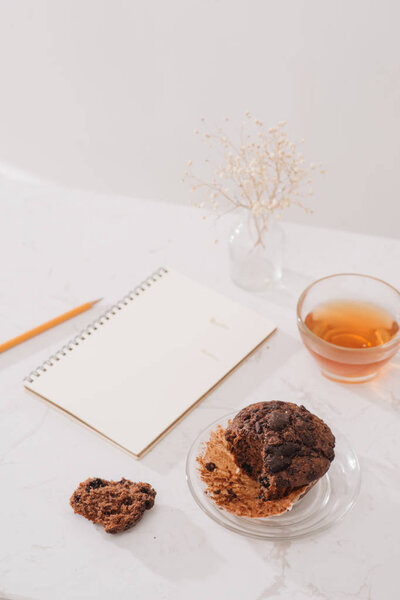 Breakfast with fresh homemade delicious muffin and tea.