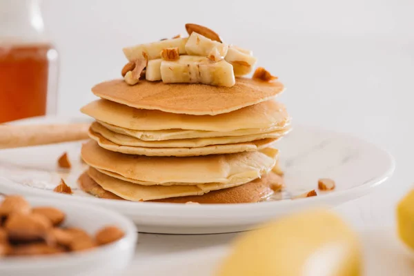 banana cashew pancakes with bananas and salted caramel sauce. the toning. selective focus