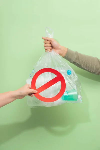 Male Hand Holding Waste Bag Isolated Green Background — Stock Photo, Image