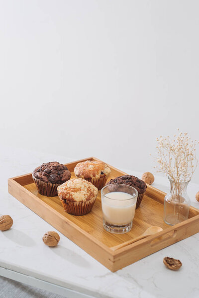 Breakfast with fresh homemade delicious muffins and milk.