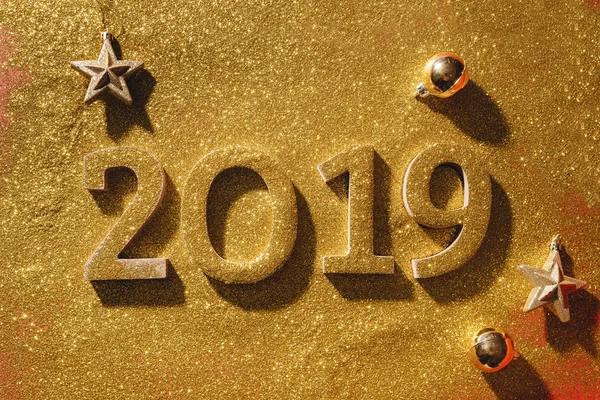 Creative new Year poster with numbers 2019 and golden decor