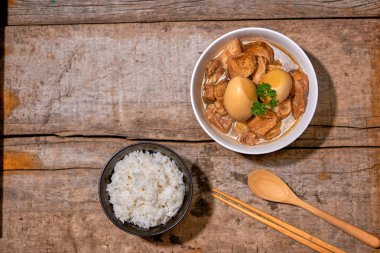 Taiwanese Cuisine. Braised pork and egg with rice. clipart