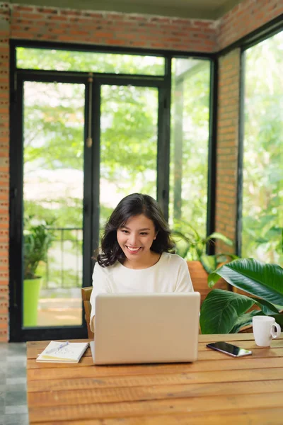 Serious Adult Single Female Sitting Table Holding Coffee Cup Typing — Stock Photo, Image