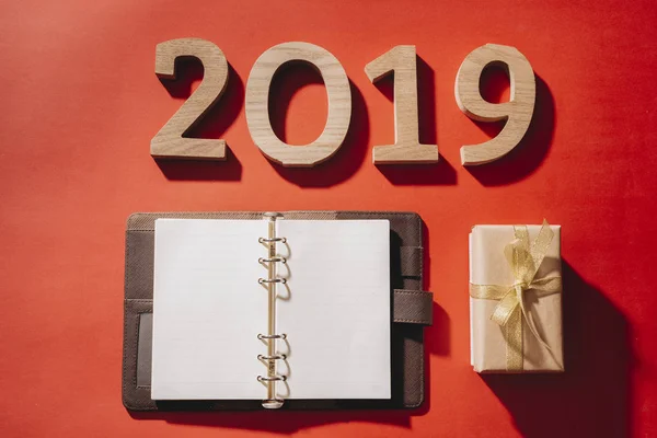 Numbers 2019 Red Background New Year Gift Box Blank Notebook — Stock Photo, Image