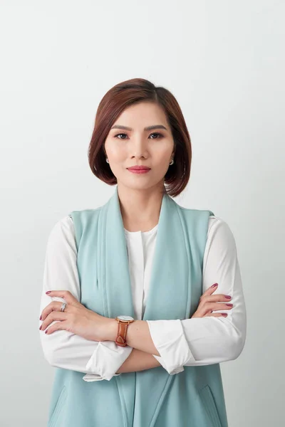 portrait of successful businesswoman looking at camera on white background