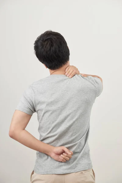 人摩擦痛苦的背部在白色背景 — 图库照片