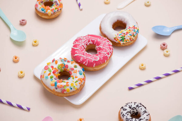 Bright birthday background with doughnuts and decorations