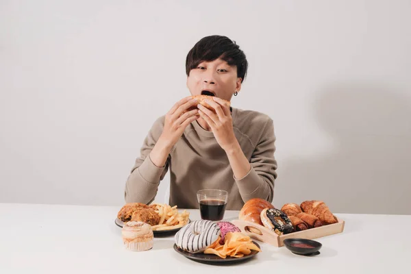 Portrait Asian Man Sitting Snacking Donuts Isolated White Background Fat — 图库照片