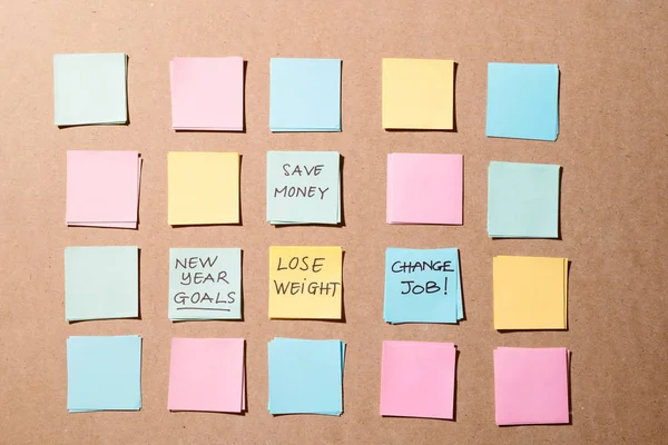 new year goals or resolutions - colorful sticky notes on the board