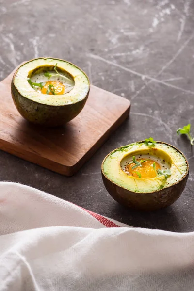 Homemade Organic Egg Baked in Avocado with Salt and Pepper