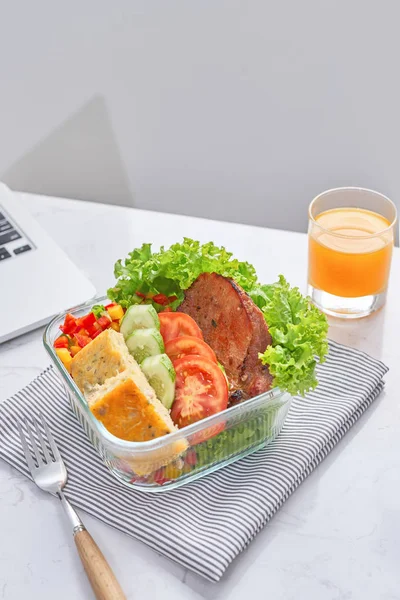 Homemade lunch box at modern stylish work place, view from above — Stock Photo, Image