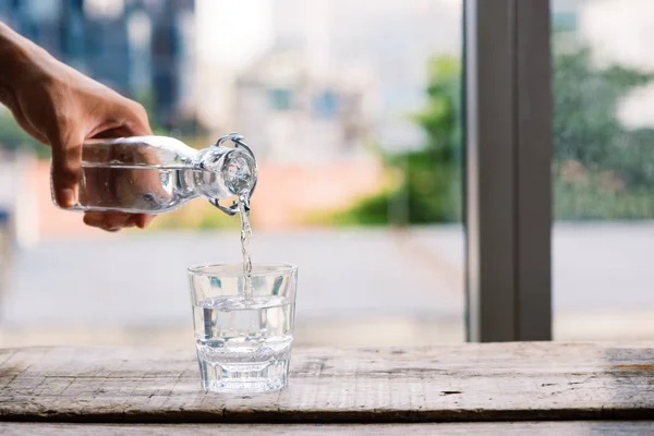 Pouring Purified Fresh Drink Water Bottle Table Living Room — Stock Photo, Image