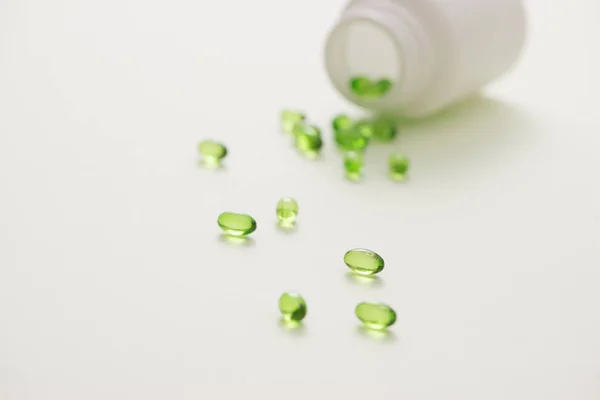 Green Capsules Bottle Isolated White Background Stock Image