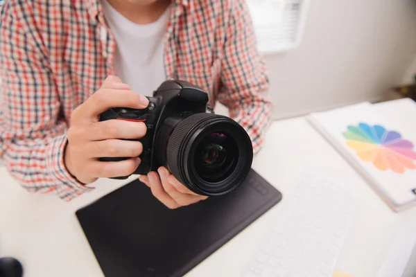 Male Photographer Sitting His Desk Looking Camera — Stock Photo, Image