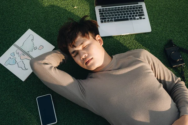 Man Sleeping Grass Laptop Notebook Mobile Phone Camera — Stock Photo, Image