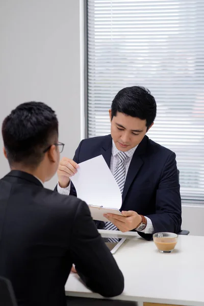 Job interview of two business professionals. Greeting new colleague