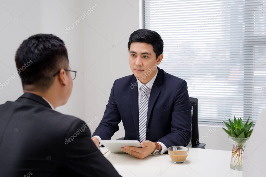 Job interview of two business professionals. Greeting new colleague