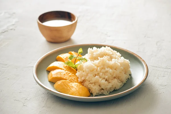 mango with sticky rice - popular traditional dessert of Thailand