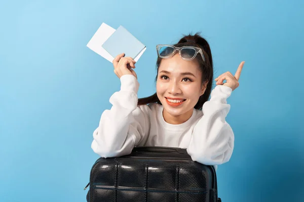 Young Asian Woman Sitting Suitcase Holding Passport Blue Background — Stock Photo, Image