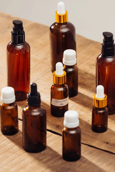 Essential Oils Bottles Wooden Desk Candlelight Spa Wellness Set — Stock Photo, Image