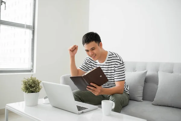 Handsome Young Man Sitting Living Room Couch Writing Some Notes — Stock Photo, Image