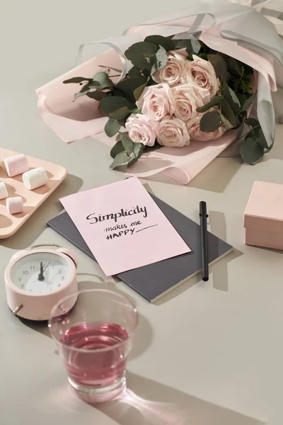 Writing letter of congratulations to mother\'s Day on white table close-up
