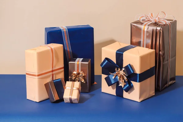Christmas wrapped gift boxes on blue background