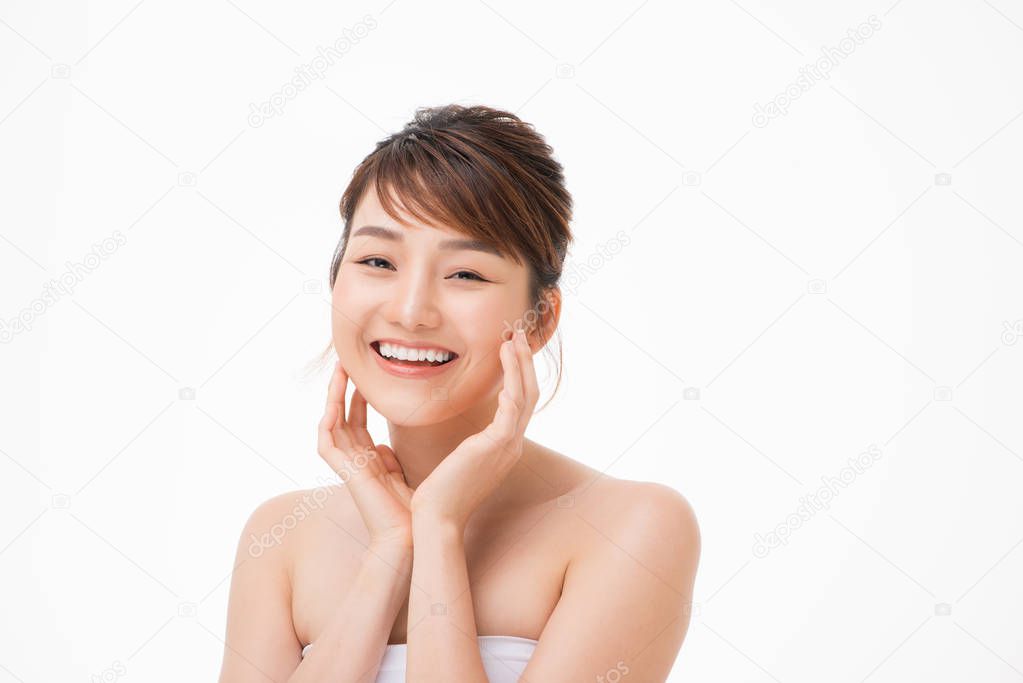 Portrait of Beautiful Skin care woman enjoy and happy, touching her face,isolated with clipping path.