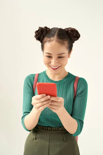 Photo Happy Charming Girl Eyeglasses Using Cellphone Isolated Color Background — Stock Photo, Image