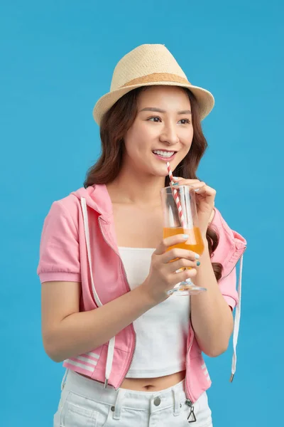 Happy Young Woman Drinking Juice Blue Background — Stock Photo, Image