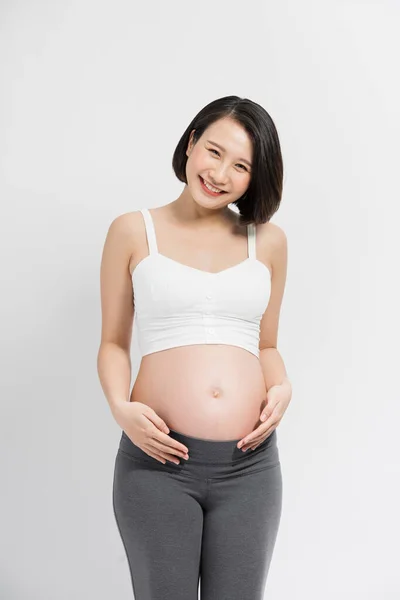 Mulher Grávida Vestido Mantém Mãos Barriga Fundo Branco — Fotografia de Stock