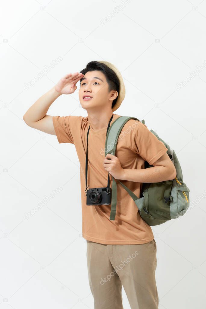 Asian tourist man looking away with hand on forehead isolated on white background